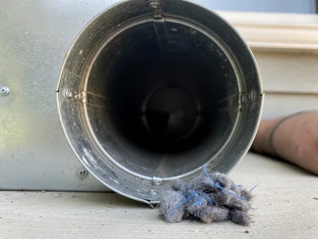 Fort Lauderdale Dryer Vent Cleaning technician using specialized equipment to clear severe dryer vent blockage in Fort Lauderdale